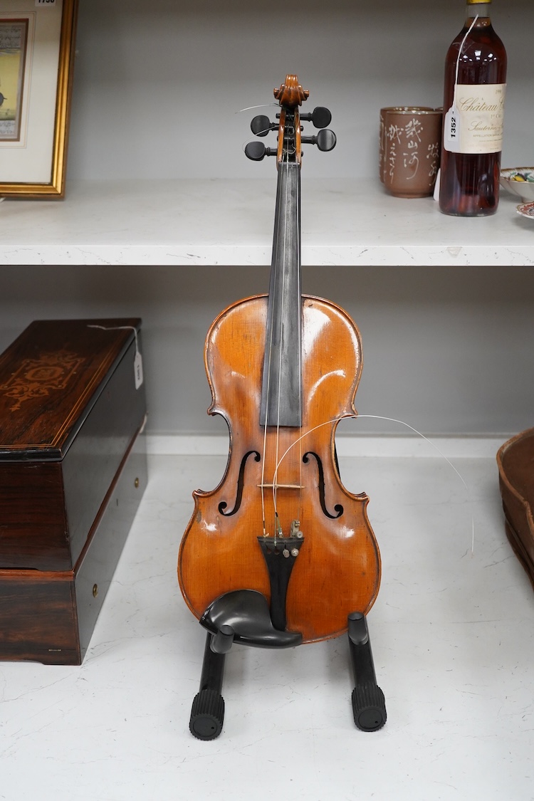 A late 19th century German violin in a Hill & Son oak case, with Hill canvas slip cover, together with an unbranded silver mounted bow, and another, ivory submission ref: 9HJU3B45 and ZC2E1GCP